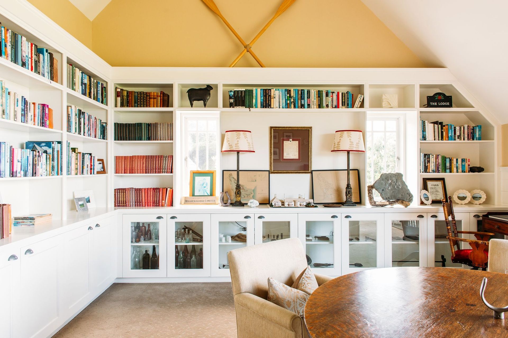 The library is decorated with warm colours to counteract the unusual light in the area thanks to the wide outlooks of sea and sky, says Nikki. “It's a nice little space with a fireplace where you can tuck yourself away.”