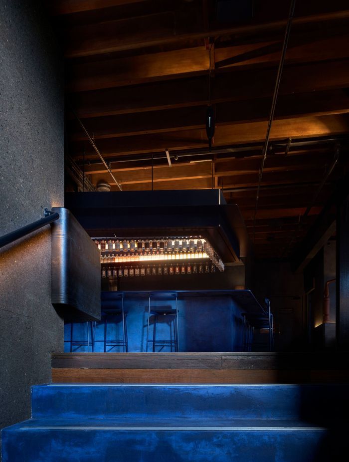 Juniper berry blue stairs lead the way to the Gin Lab and Eileen's Bar.