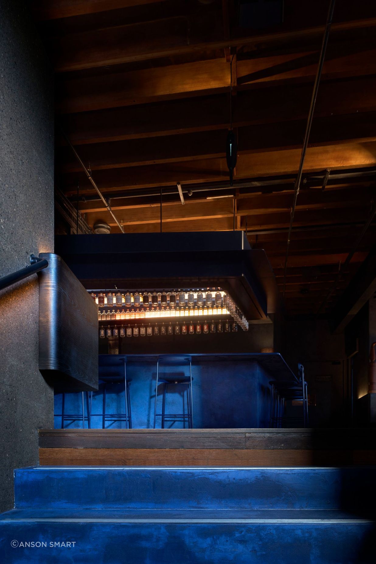 Juniper berry blue stairs lead the way to the Gin Lab and Eileen's Bar.