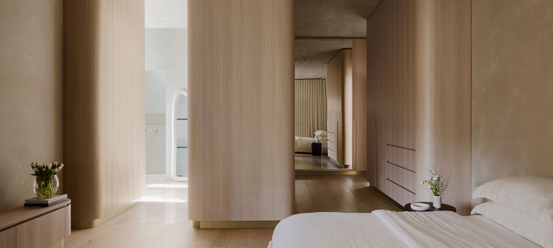 The AMMOS Residence in South Australia embraces curves and timber veneers at every turn.