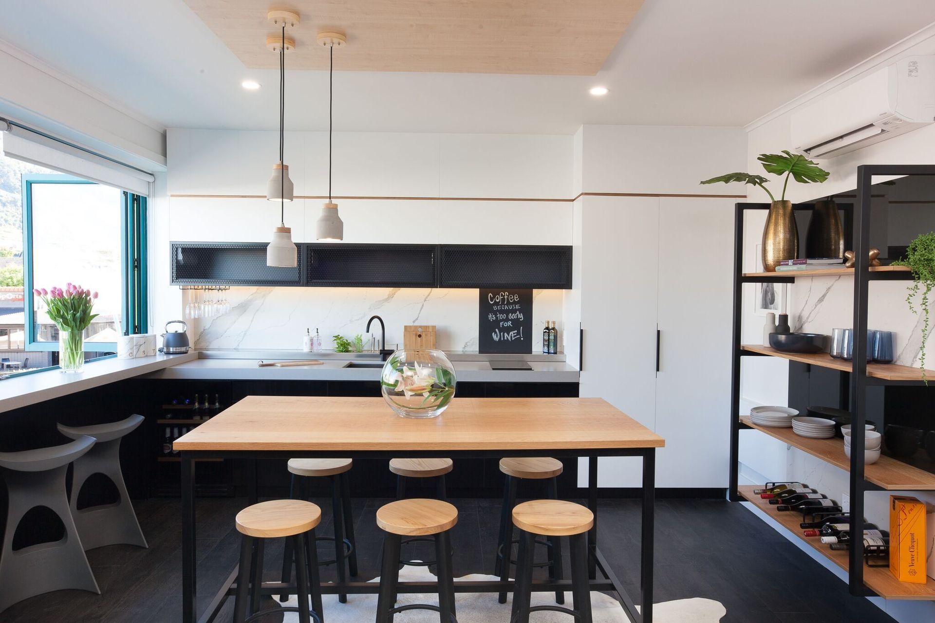 A fun and funky take on the black and white kitchen in Mount Maunganui by Vekart Ltd.