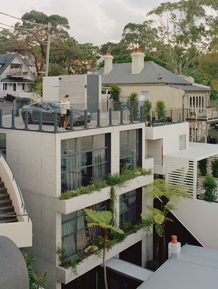 The off form concrete tower connects with the original house through a glazed corridor.