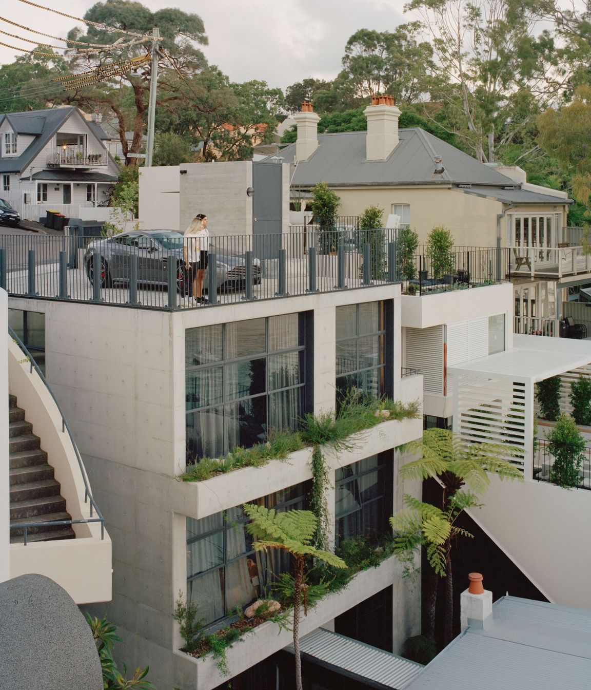 The off form concrete tower connects with the original house through a glazed corridor.
