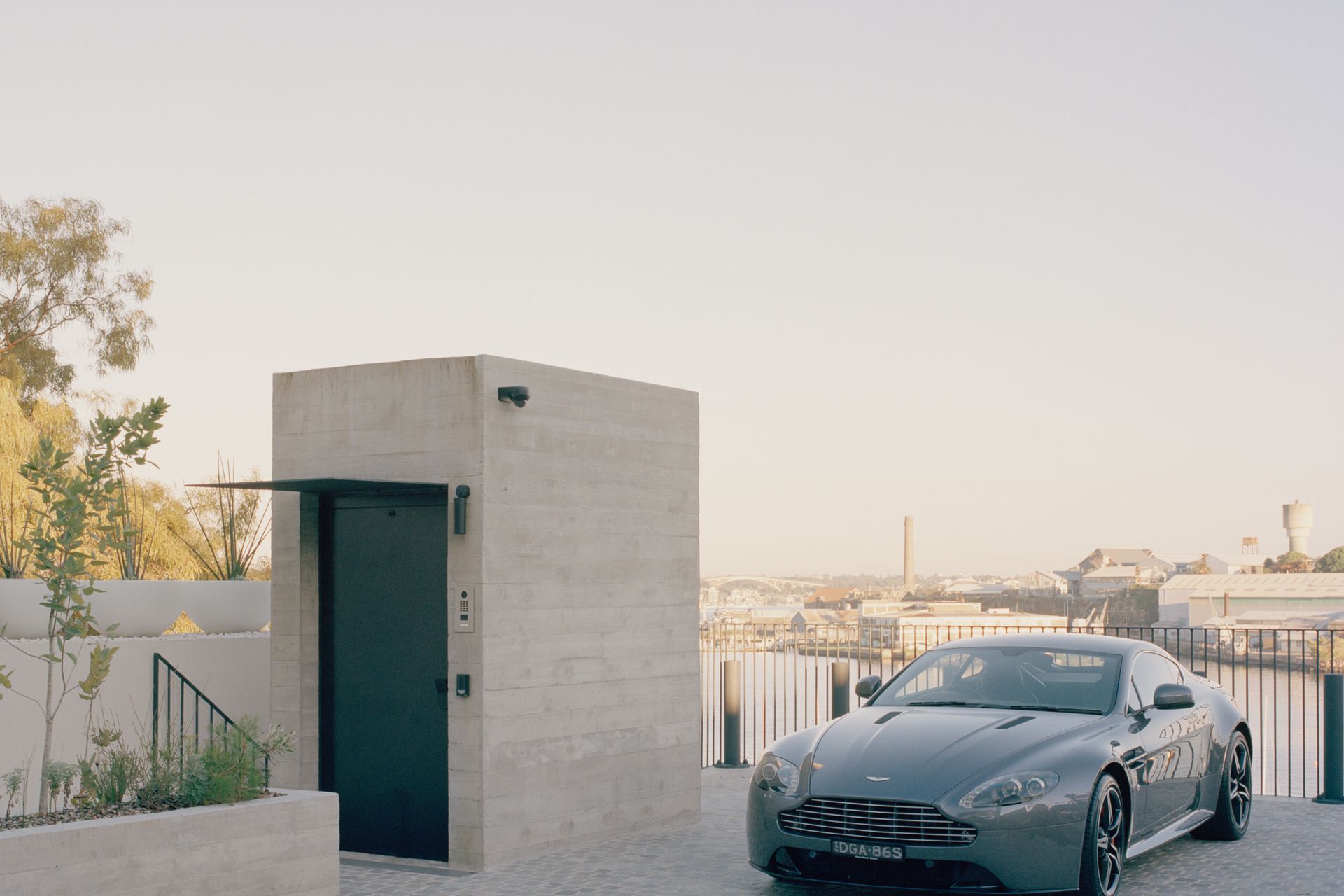 The lift protruding from the concrete form at street level is the only indication of the jaw-dropping structure below.