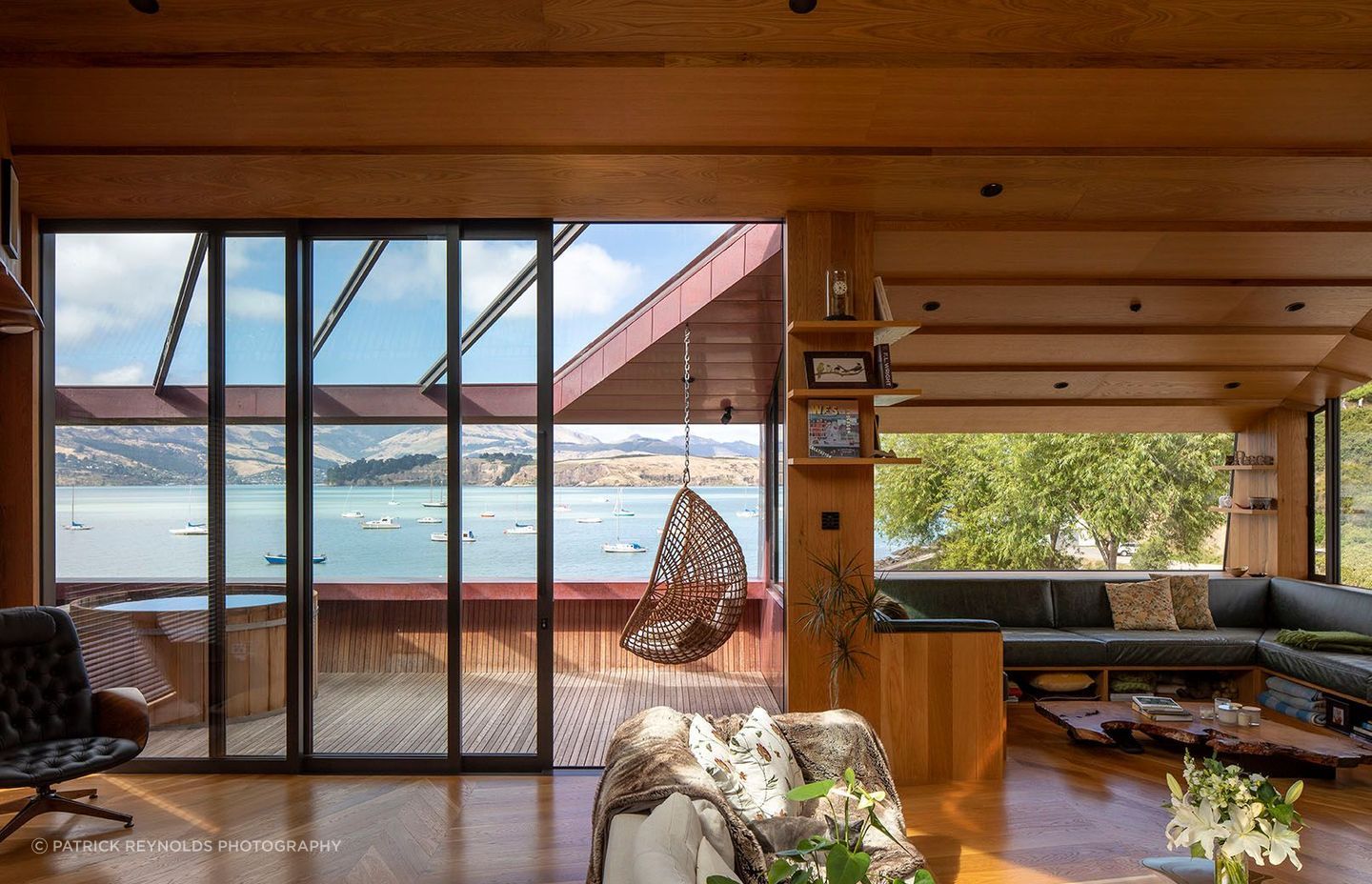 The Green family had long wanted to live in Lyttelton’s Cass Bay. The decorative parquet flooring is a representation of the mountainous ridgeline behind the home – JSC Timber supplied all timber finishes for the home. The spa on the deck is from Colonial Hot Tubs.