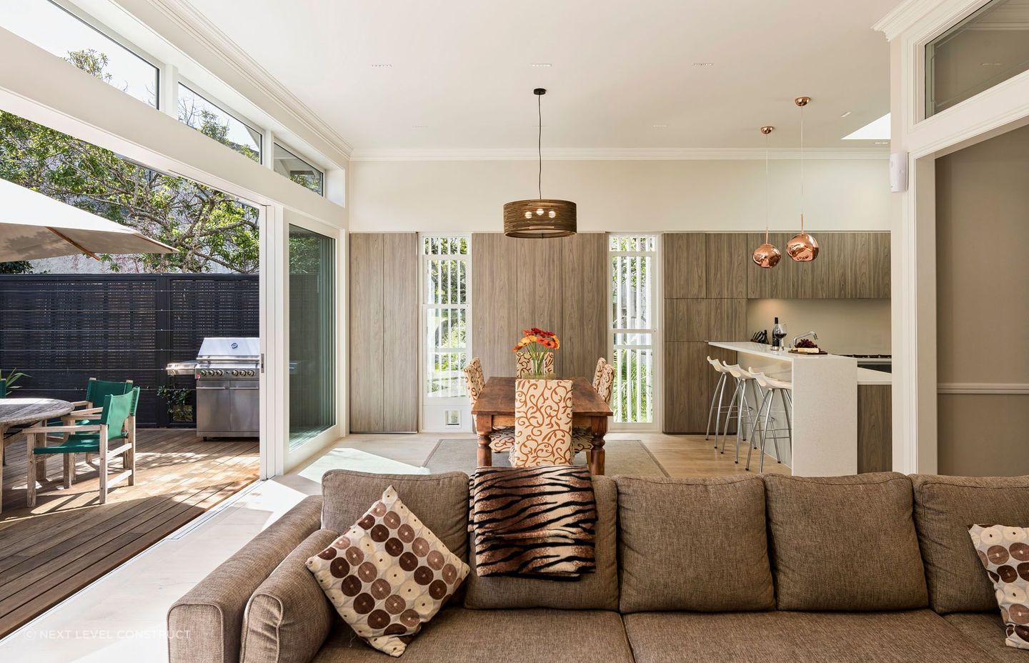 Spacious open plan kitchen and living areas that extend into the outdoor living space.