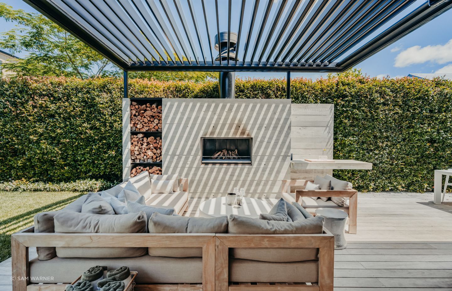 The outdoor fireplace and living area is a favourite place for the clients to entertain family and friends.