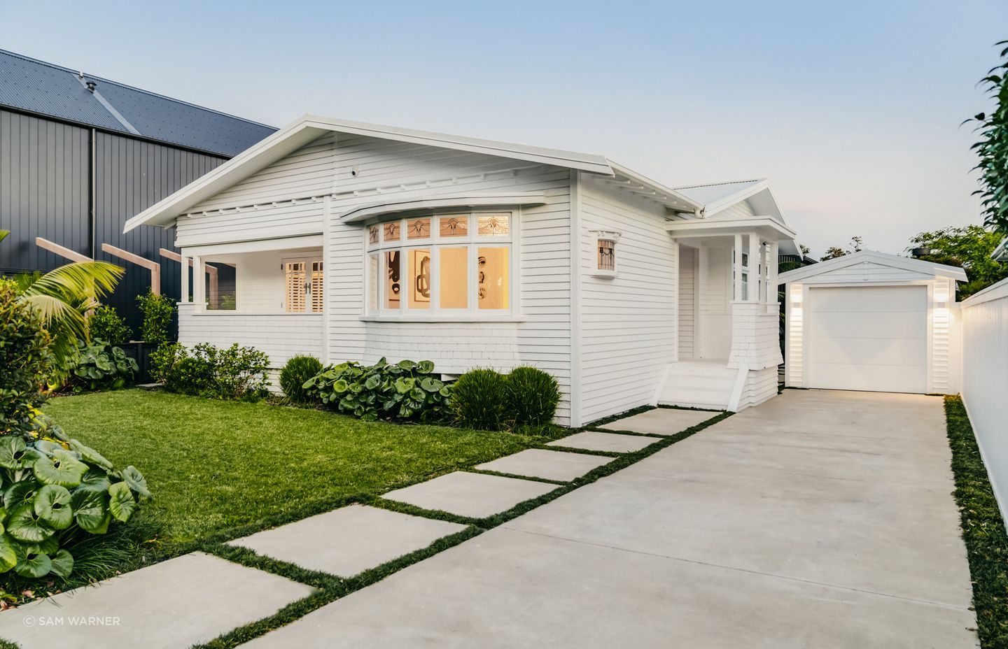 From the road front, the bungalow retains its original facade.