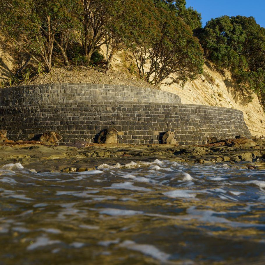 Auckland Stonemasons protect pohutukawa from the rising tide with expertly crafted sea wall