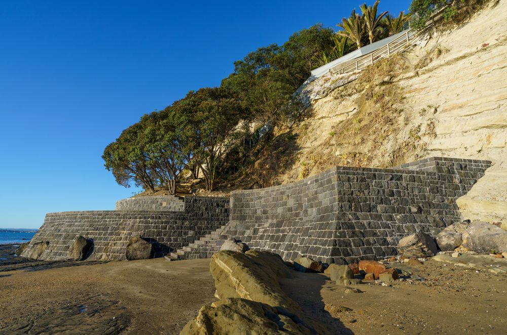The client was concerned about protecting the pohutukawa trees on his property, engaging Auckland Stonemasons to build a sea wall that would stop them being washed away in the event of a storm.