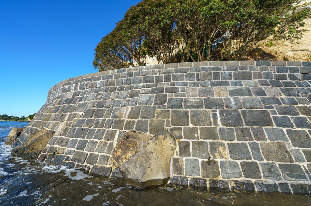The wall has created a platform for the homeowner to store his boat and swim on warm days.