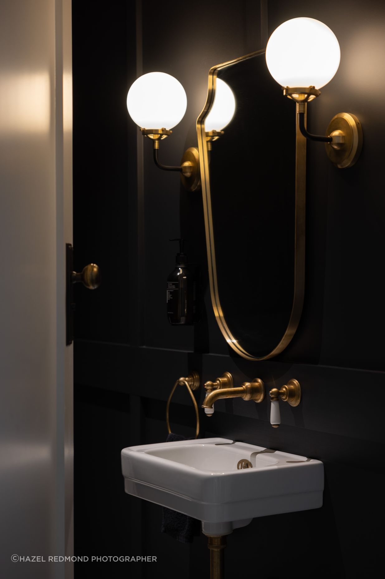 Gold accents add a luxurious feel to the bathrooms.