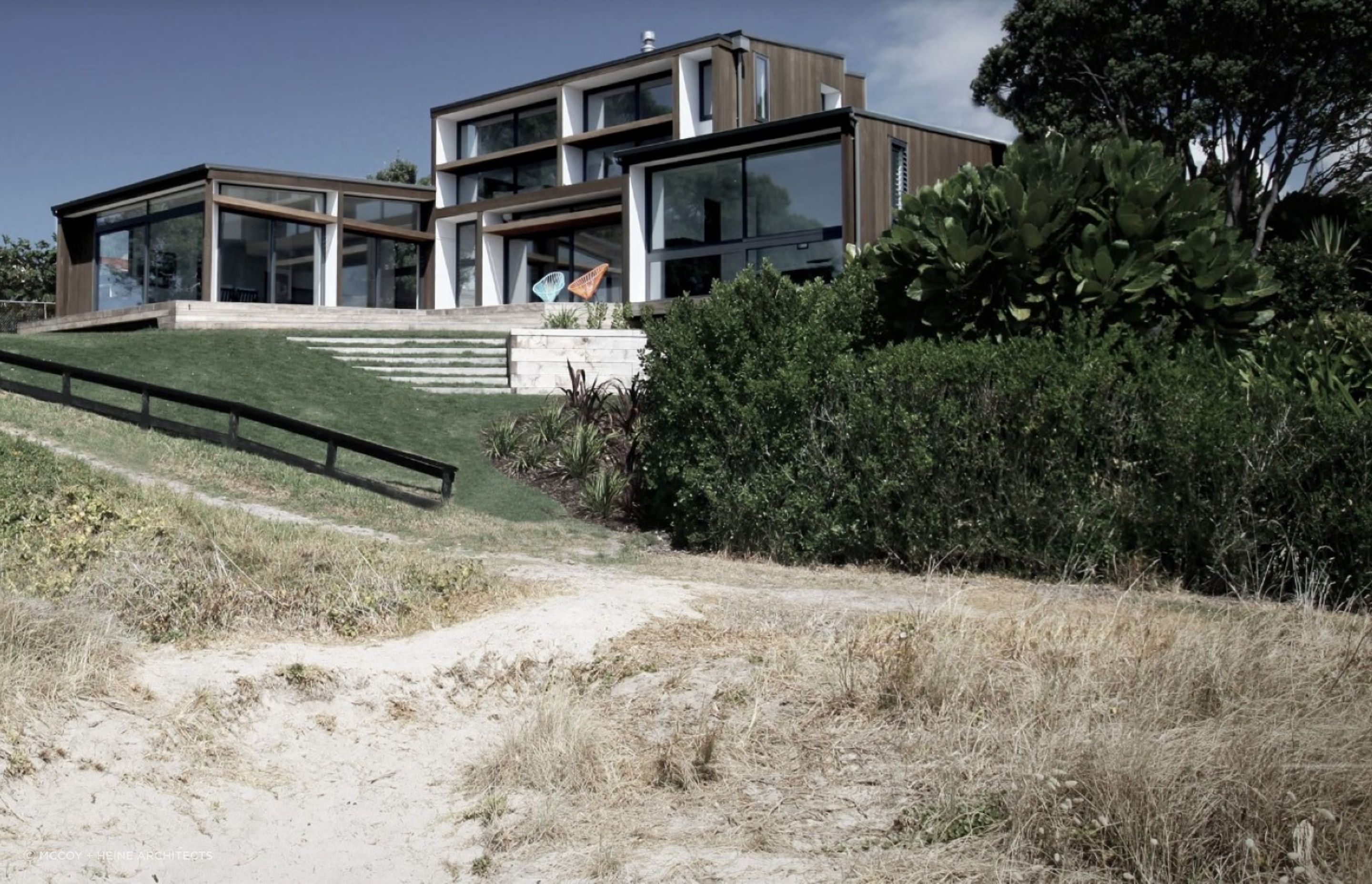 The sophisticated use of extensive glazing facilitates the open feeling of the sublime Hahei Beach House.