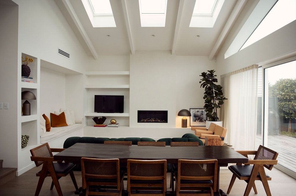 Space was optimised by creating an open-plan cathedral-like room with vaulted ceilings, exposed rafters, and skylights to allow for ample natural light.