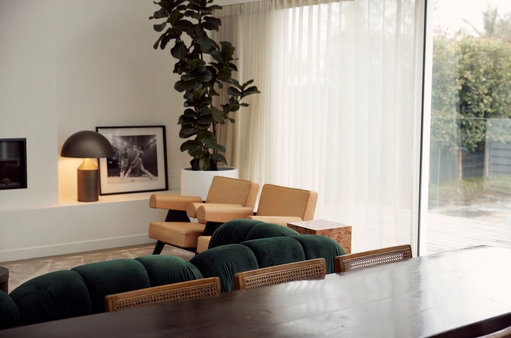 Creating flow between the indoor and outdoor living spaces, expansive stacker doors stretch the length of the room along the back wall, allowing for plenty of sunlight and fresh air.