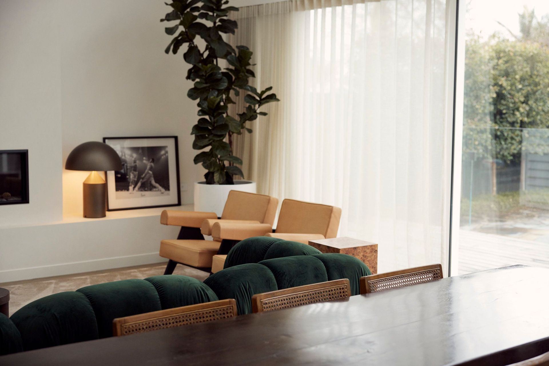 Creating flow between the indoor and outdoor living spaces, expansive stacker doors stretch the length of the room along the back wall, allowing for plenty of sunlight and fresh air.
