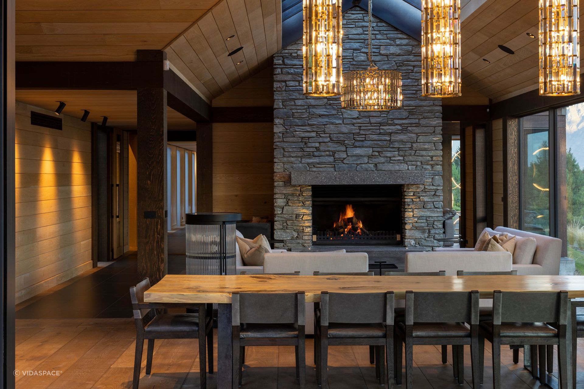 This Lake Wakatipu residence features a beautiful stone wall fireplace. | Photography: Simon Devitt