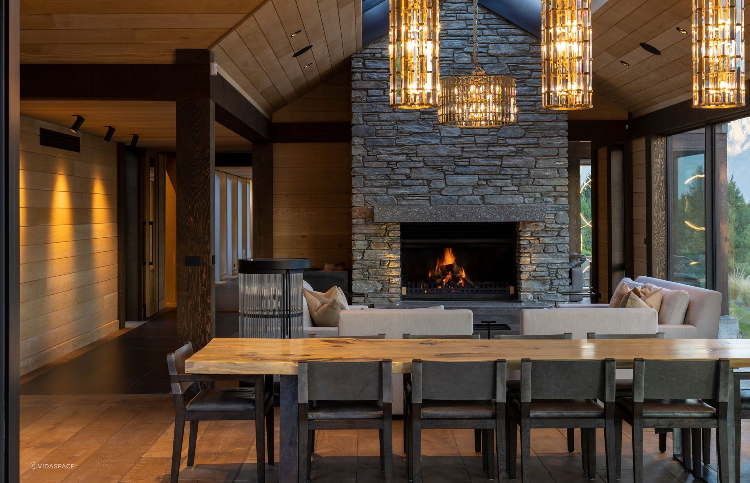 This Lake Wakatipu residence features a beautiful stone wall fireplace. | Photography: Simon Devitt