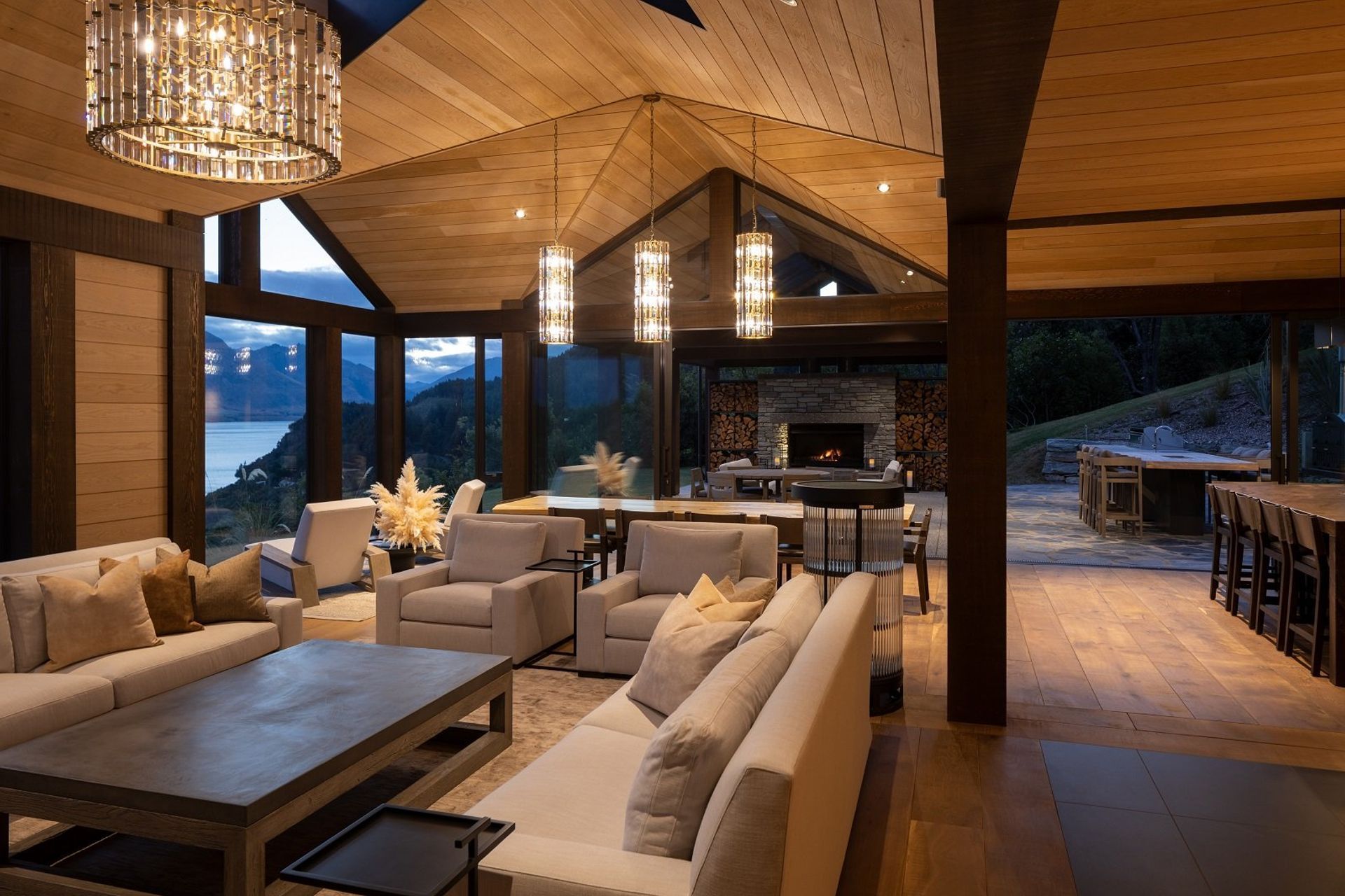 Directly mirroring the interior living spaces, is a sheltered outdoor living space, complete with fireplace, lounge area and outdoor kitchen.