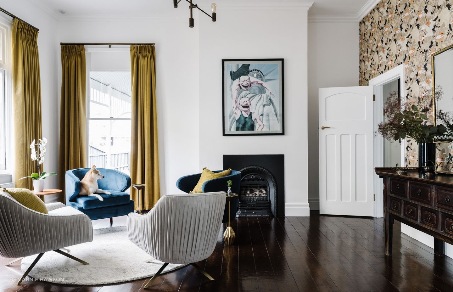 The blue velvet armchairs were made in Shanghai, with the mustard curtains made locally in Ballarat.