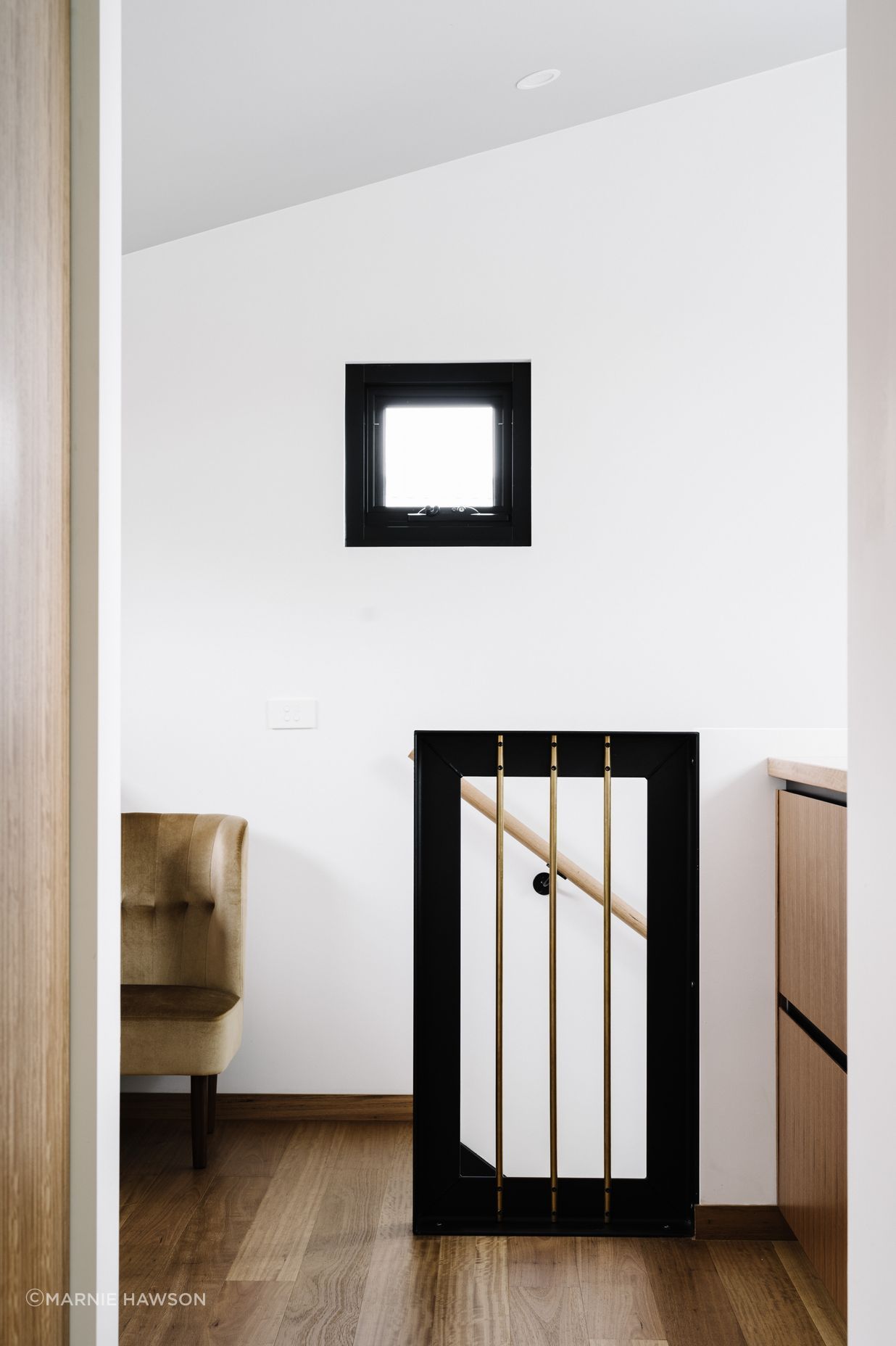 Just outside the bedroom are large blackbutt drawers and benches for packing bags before heading to the airport.