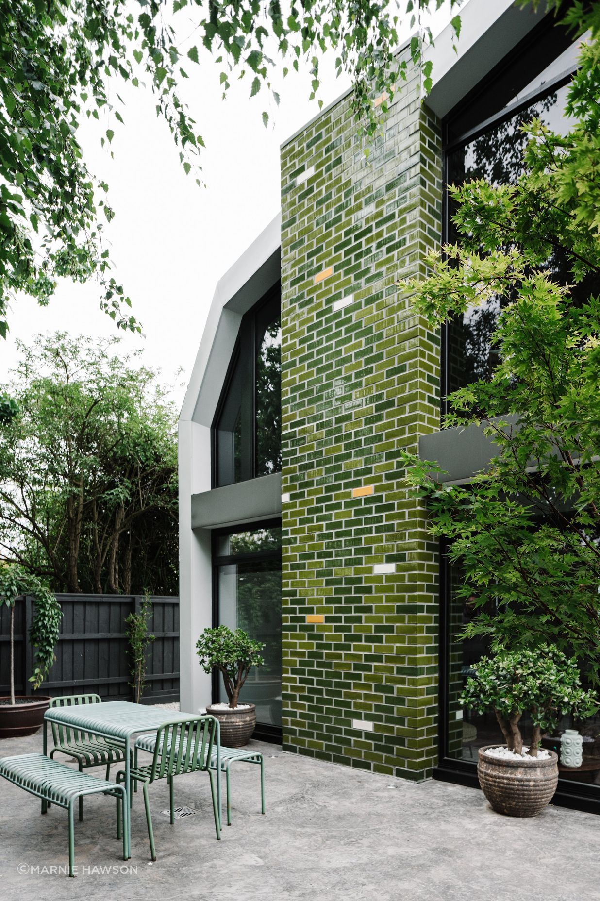 The glazed handmade brick tiles channel the Australian bush.