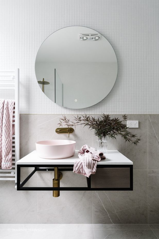 The guest bathroom is in the original part of the home. “It’s quite classic with light colours, a rose sink and brass fittings and fixtures. It’s really come out well and we’re very proud of it.”