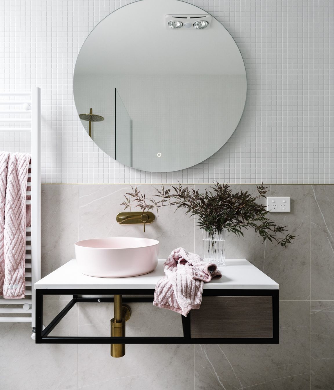 The guest bathroom is in the original part of the home. “It’s quite classic with light colours, a rose sink and brass fittings and fixtures. It’s really come out well and we’re very proud of it.”