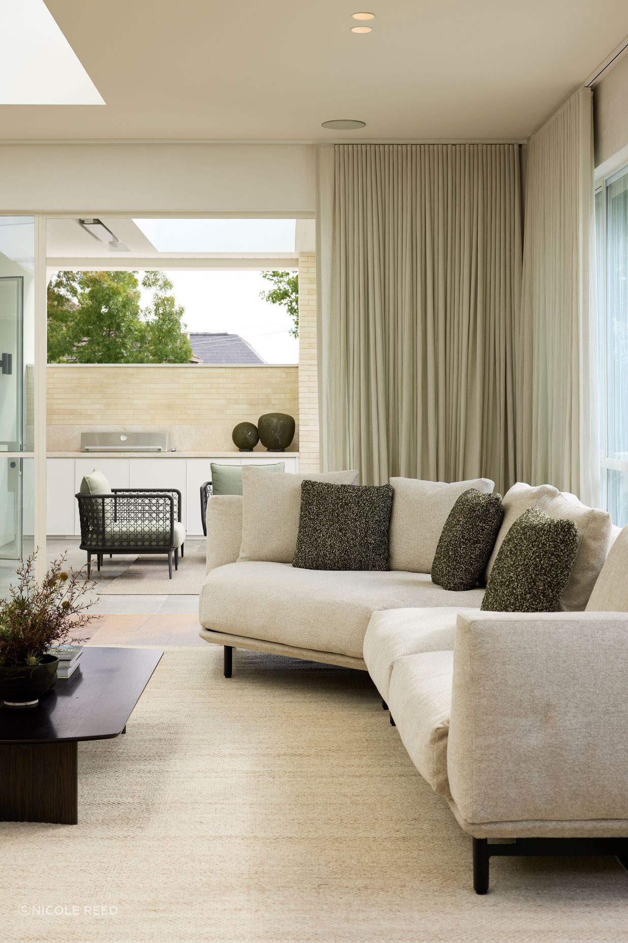 Outdoors, the Aireys woven lounge chairs are featured.