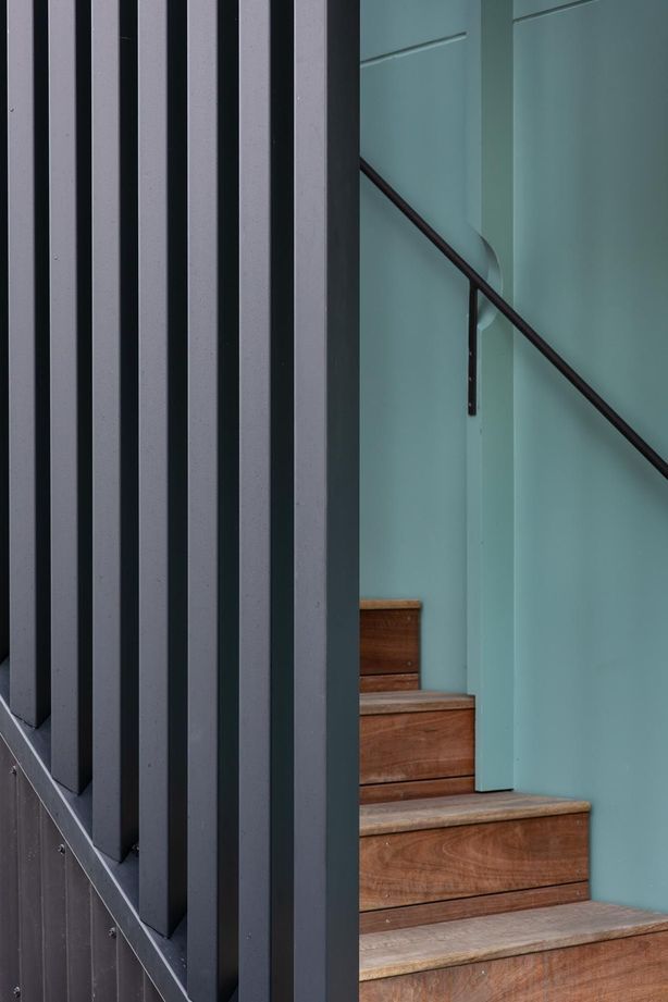 “We used the battens on the stairwell wall to run the handrail through small circular cutouts. The idea just popped out of my head at one point. It can be tricky to know how to do your brackets for the handrails.”