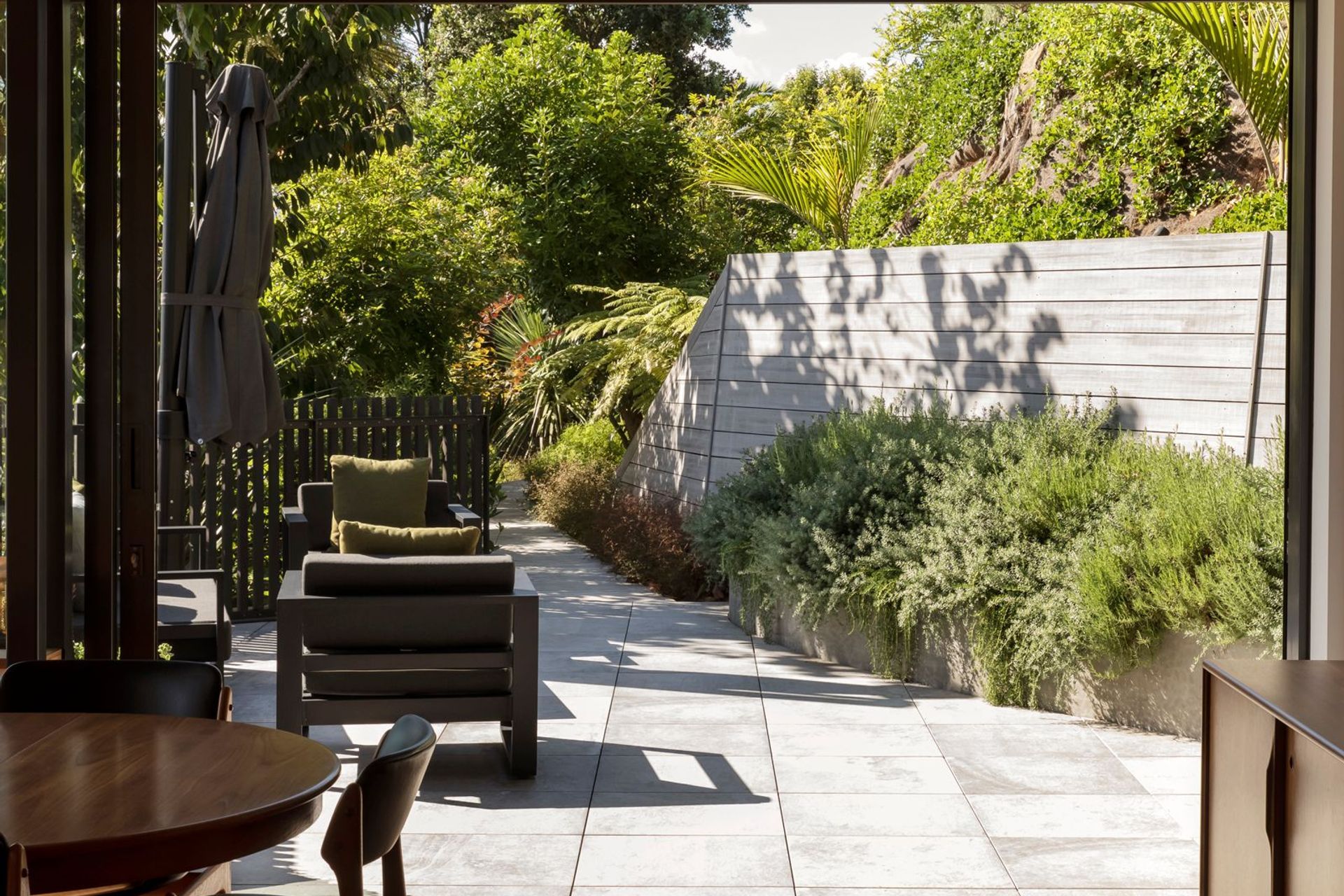 “We were all keen that the garden created a setting for the house that it could nestle into and wasn't going to be too labour-intensive. It was just going to create a kind of lushness around the house.” Landscape design is by Jared Lockhart.