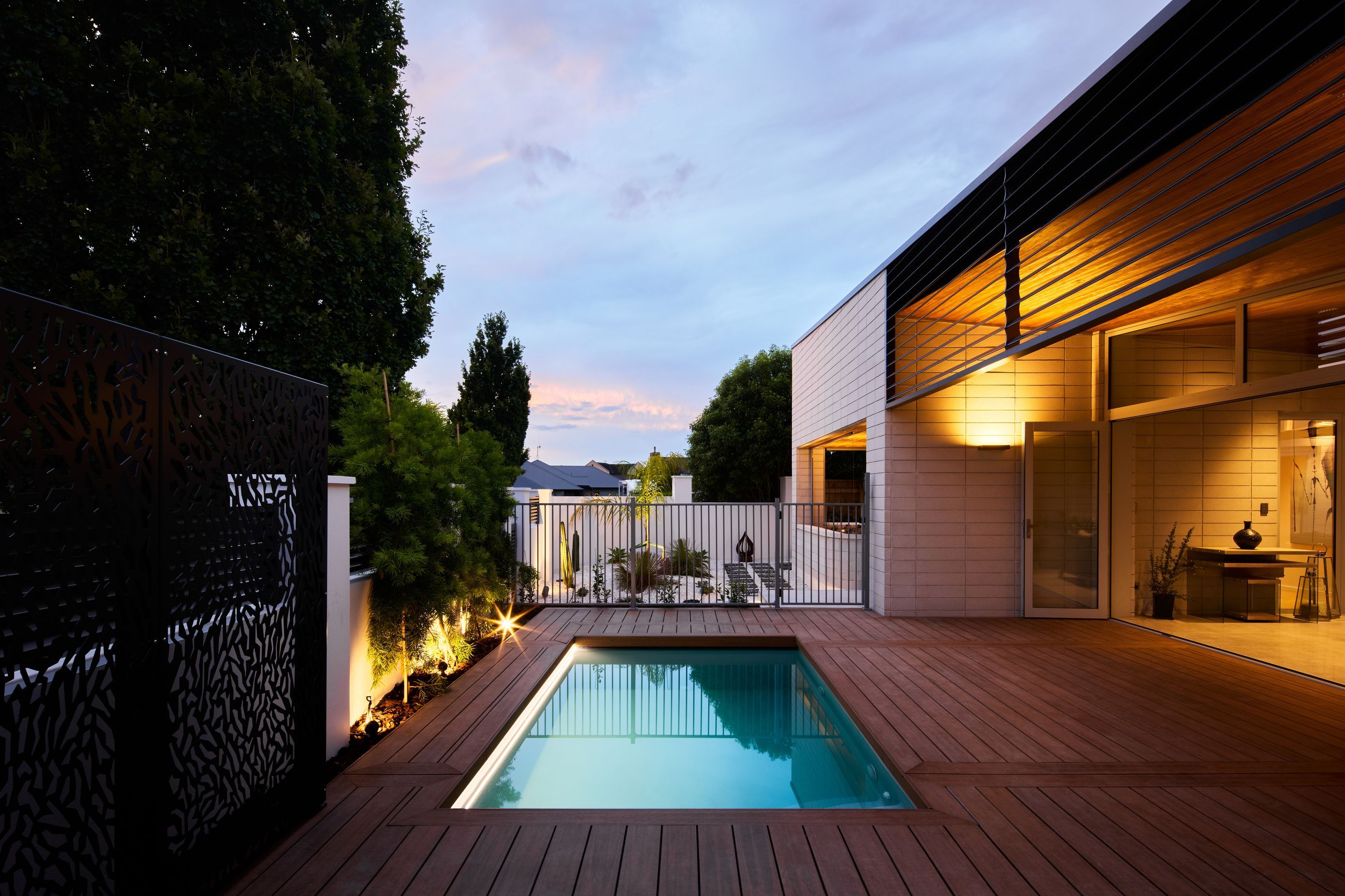 The brick creates a strong, protected feel, says Nick, punctuated with warmer Abodo timber. Louvres control the amount of evening sun in the outdoor room.