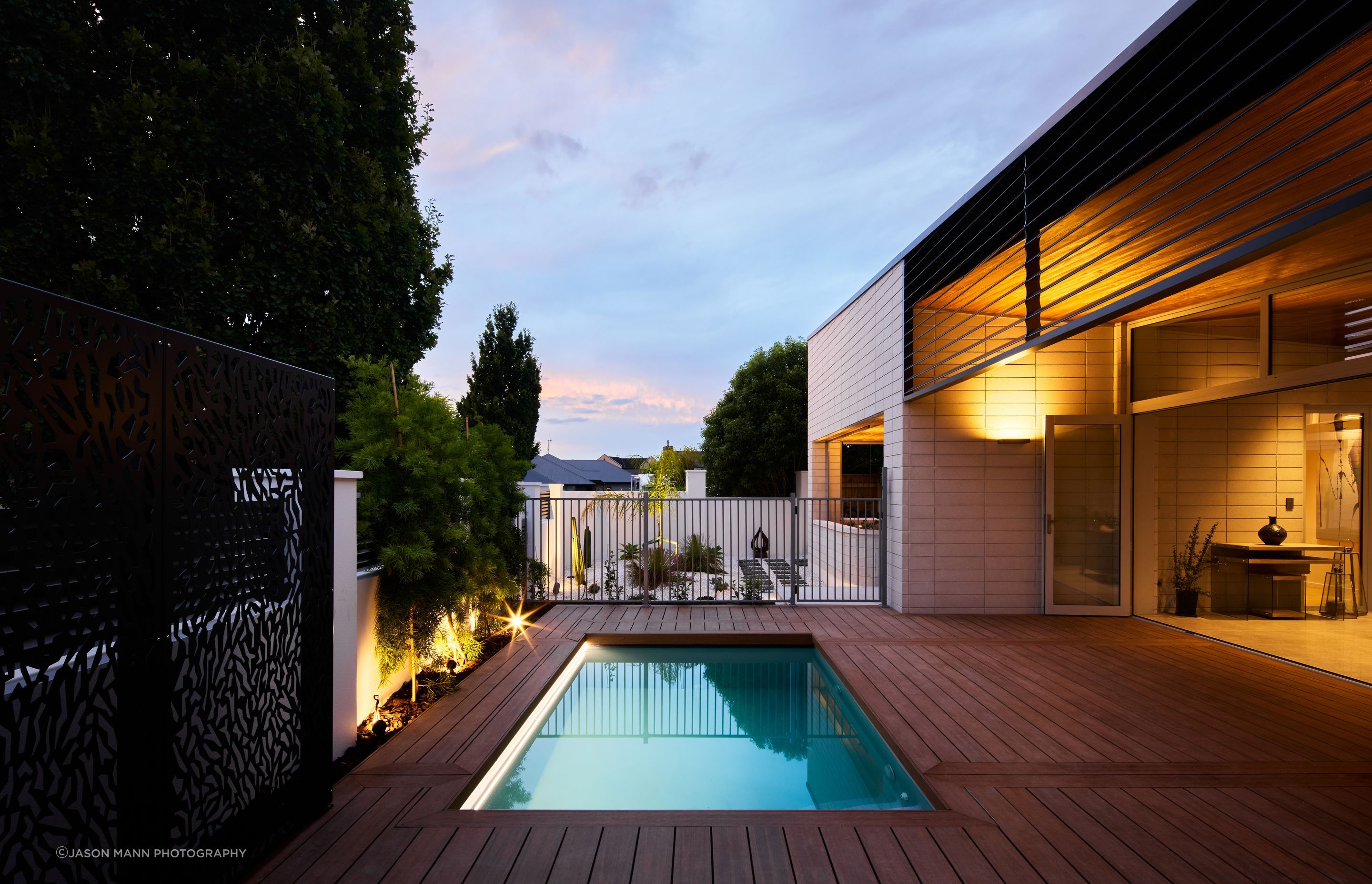 The brick creates a strong, protected feel, says Nick, punctuated with warmer Abodo timber. Louvres control the amount of evening sun in the outdoor room.