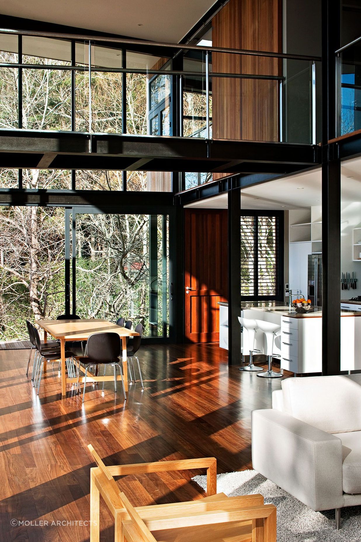 Steel frames and natural timber flooring creates a strong visual contrast.