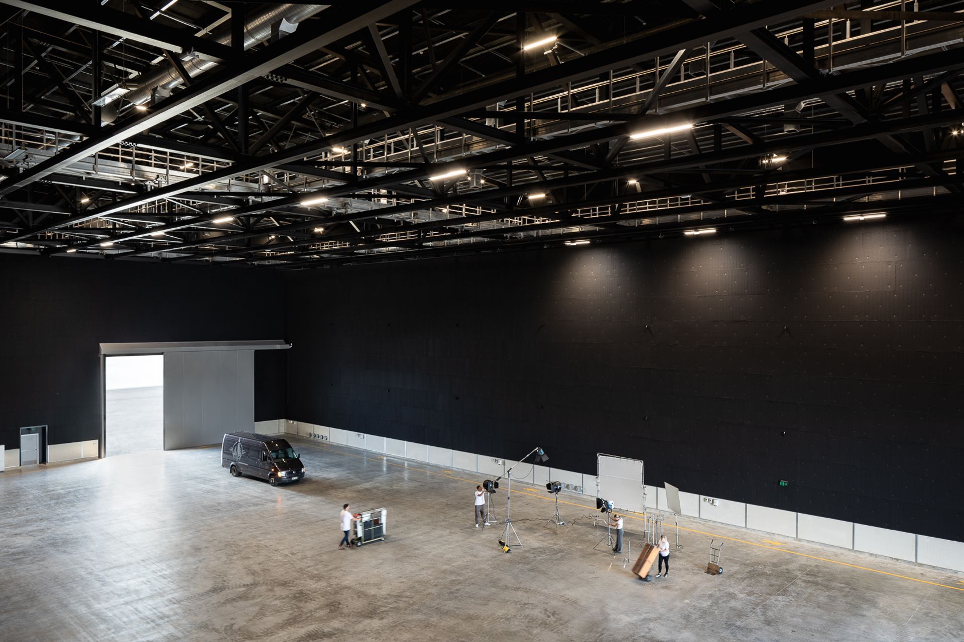 The building's external layers are completely separated from the internal layers by rubber pads and flexible sealant, creating a 'box within a box' to guarantee acoustic performance.