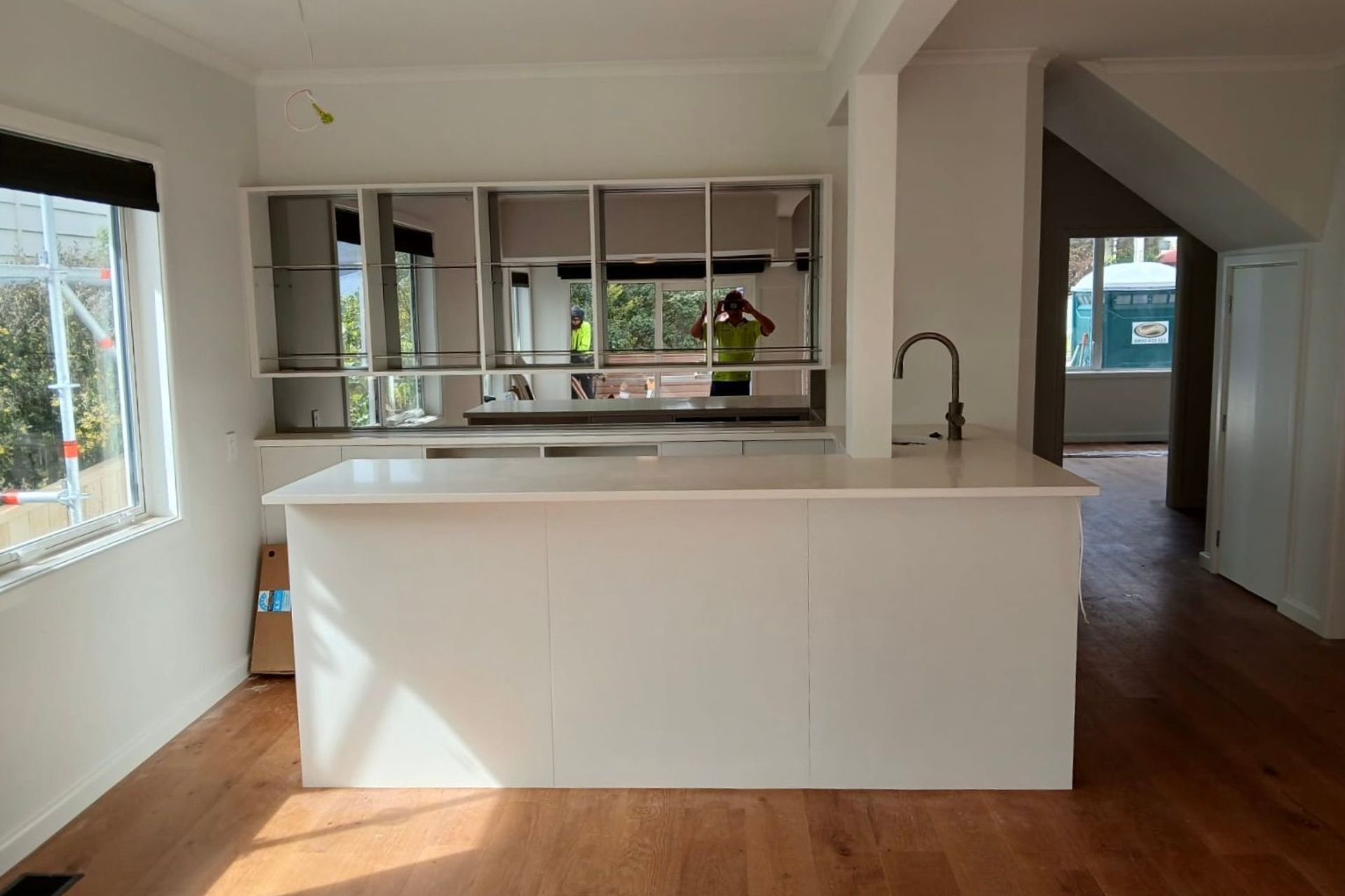 The renovated kitchen is open and full of natural light.