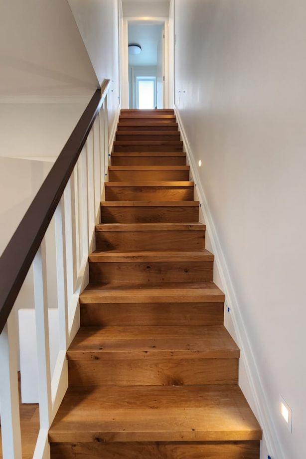 The engineered oak staircase is a standout feature of the home.