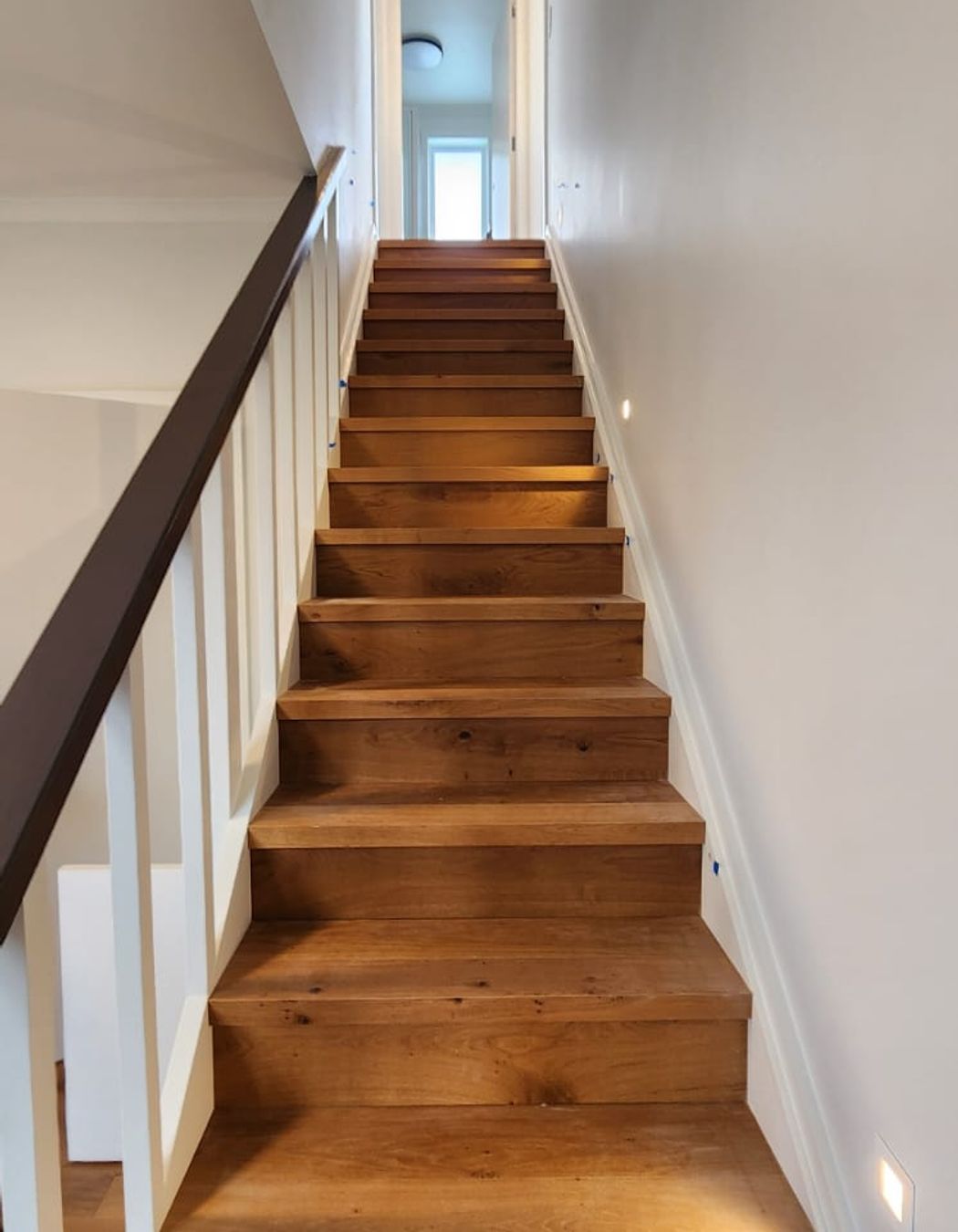 The engineered oak staircase is a standout feature of the home.