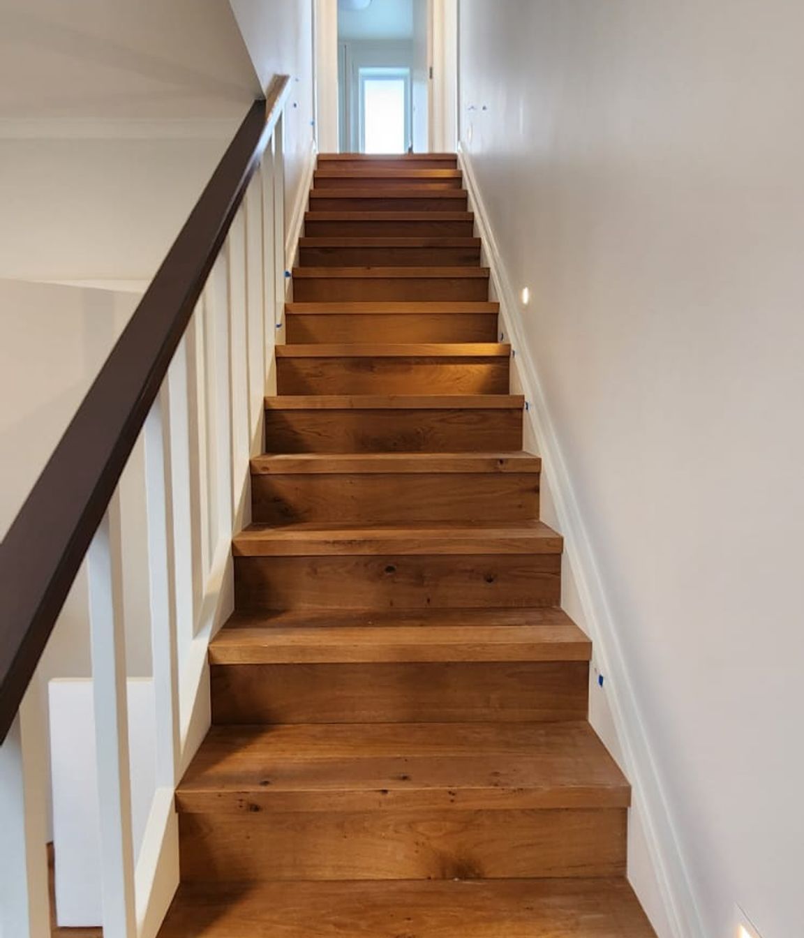 The engineered oak staircase is a standout feature of the home.
