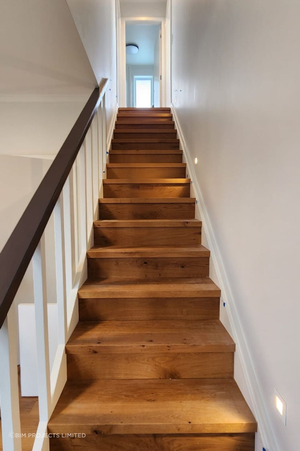The engineered oak staircase is a standout feature of the home.