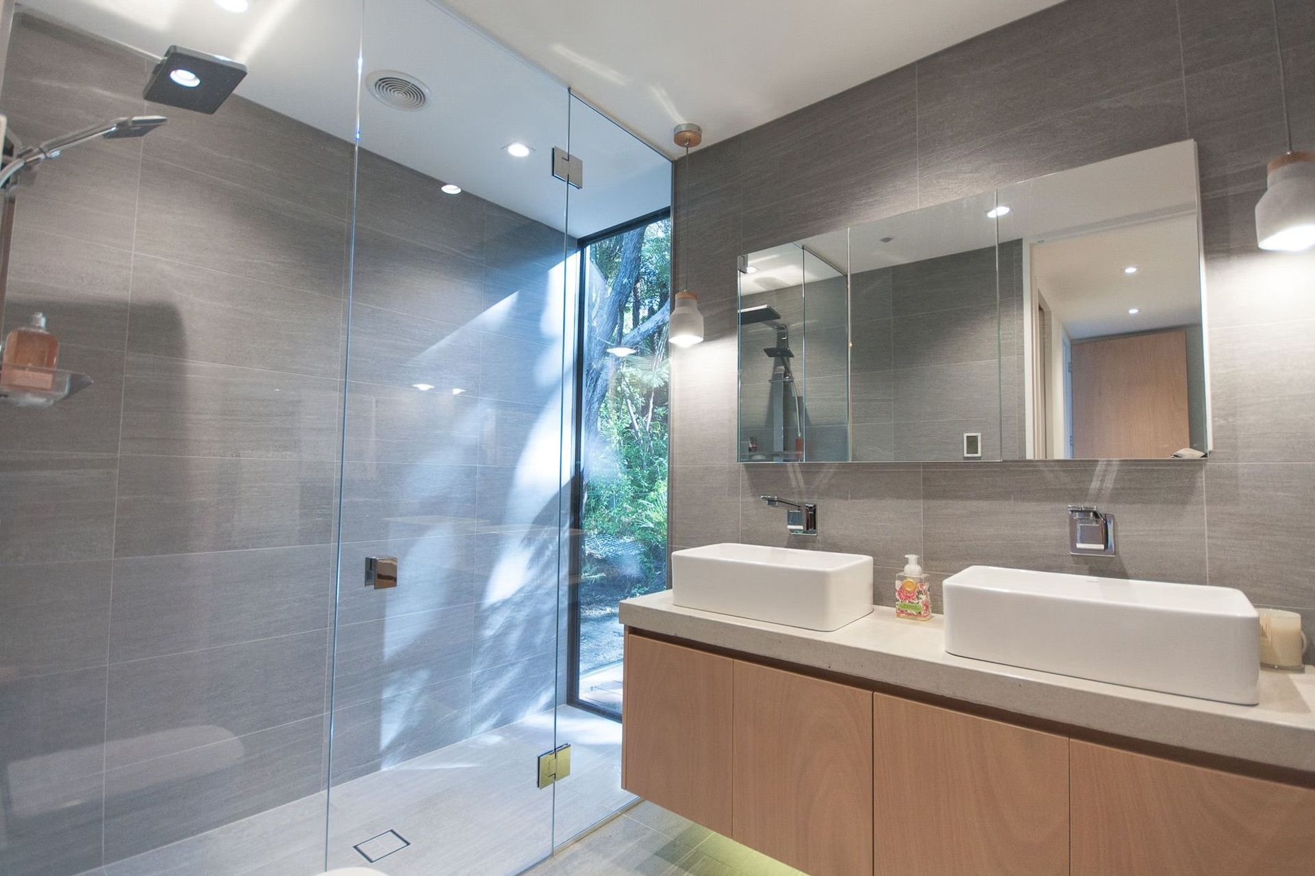 The shower window is a favourite feature for owners Ben and Kylie, and builder Ray.