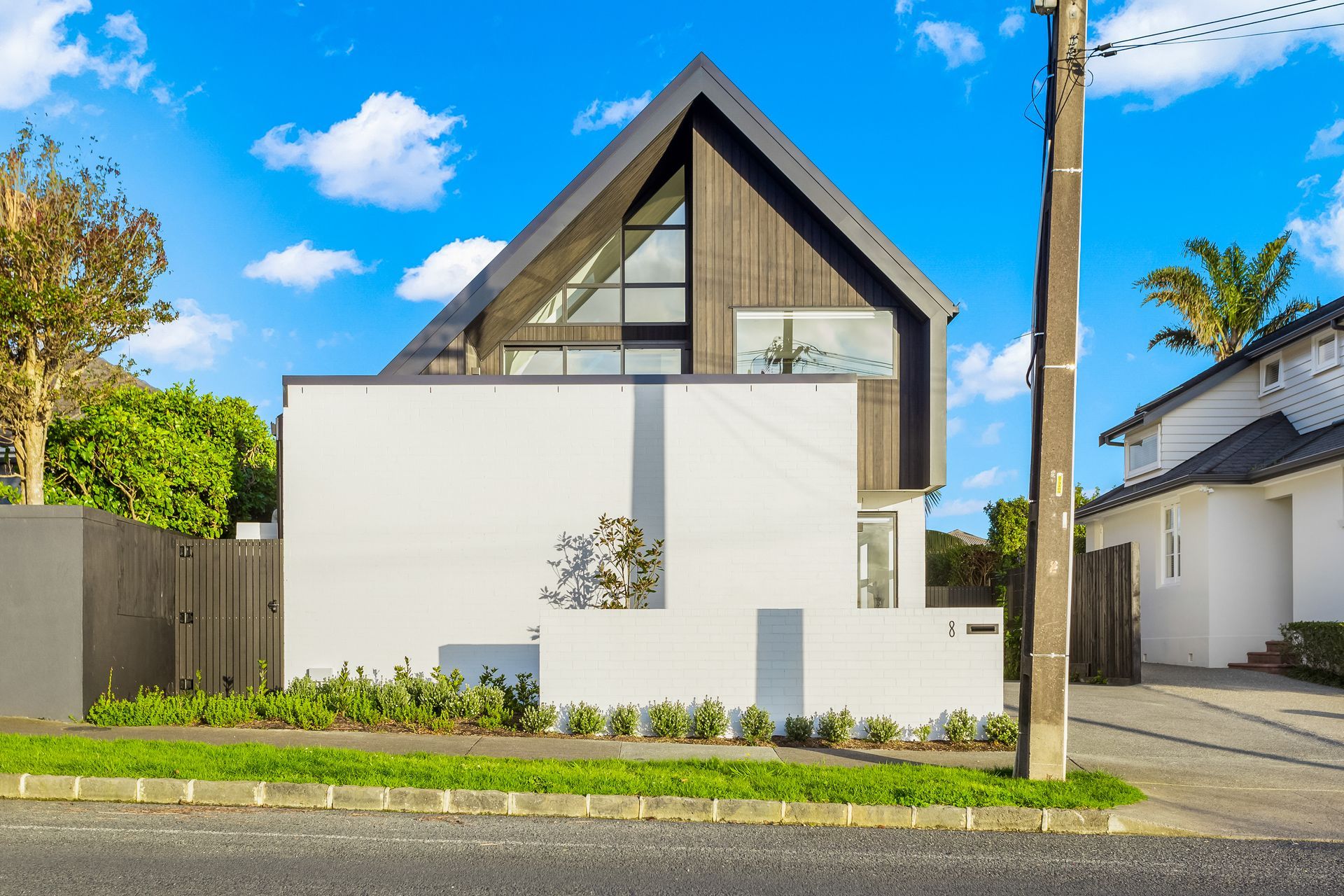 The pleasing geometry of the gable form and triangular window juxtaposes nicely against the rectangular form of the garage.