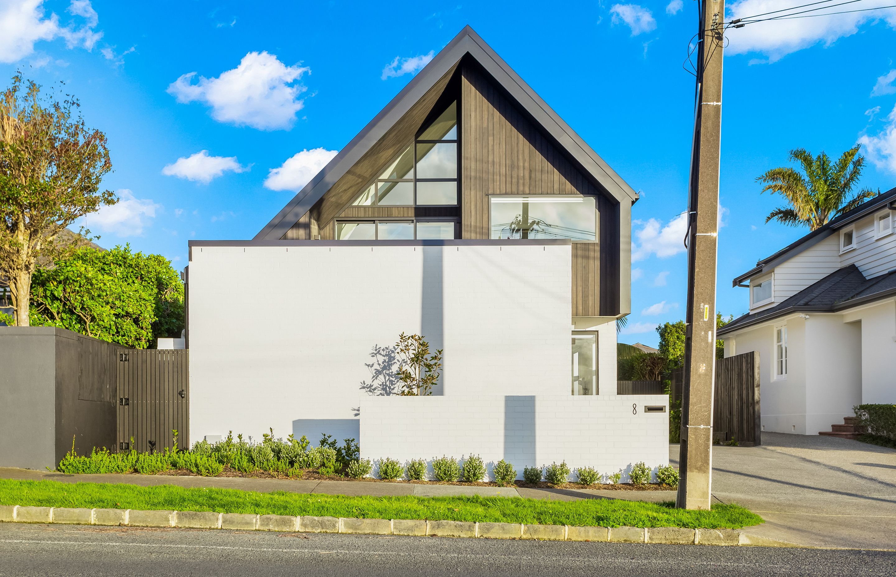 The pleasing geometry of the gable form and triangular window juxtaposes nicely against the rectangular form of the garage.