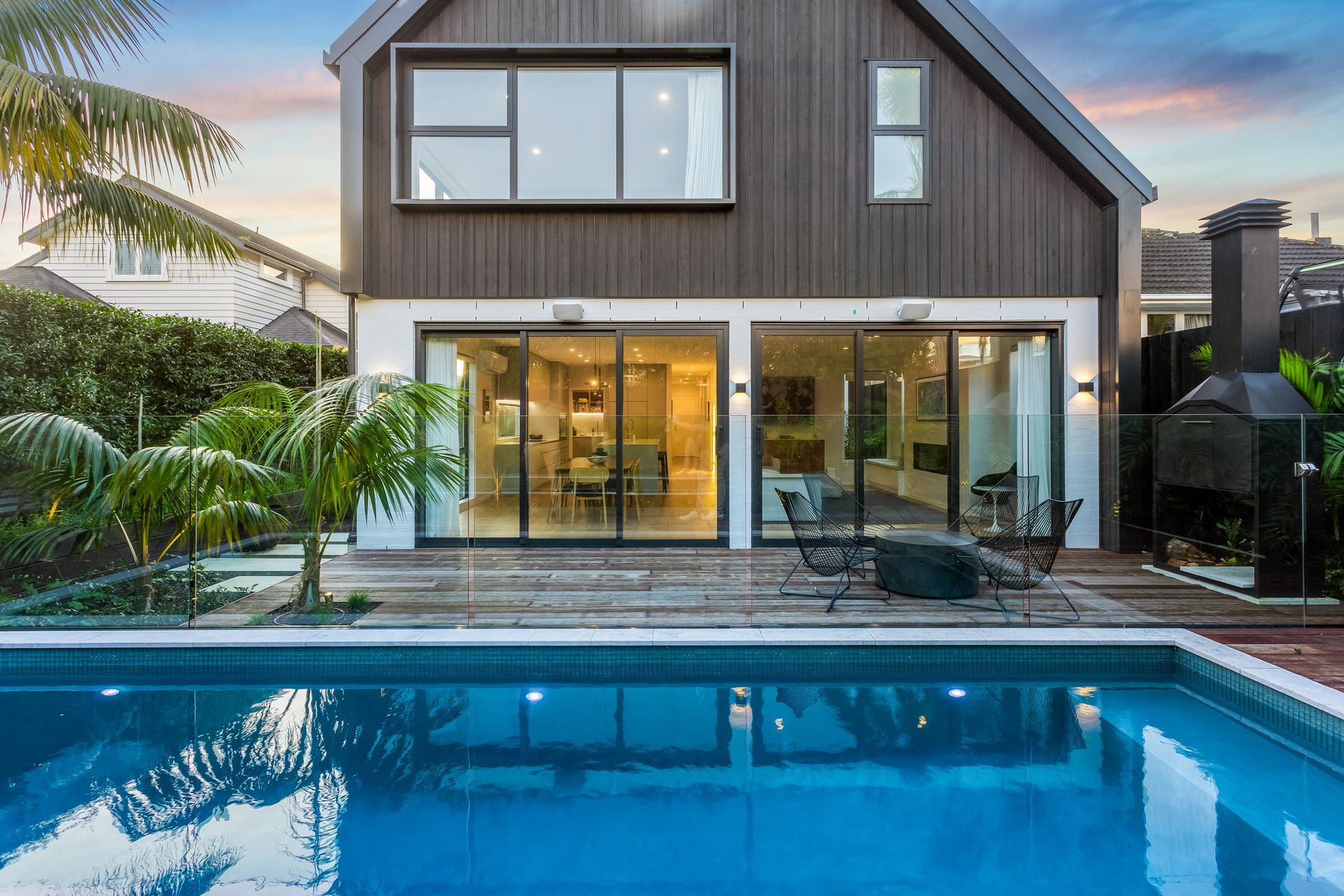 In spite of being sited at the south side of the property, the living space enjoys plenty of light and views out to the idyllic pool.