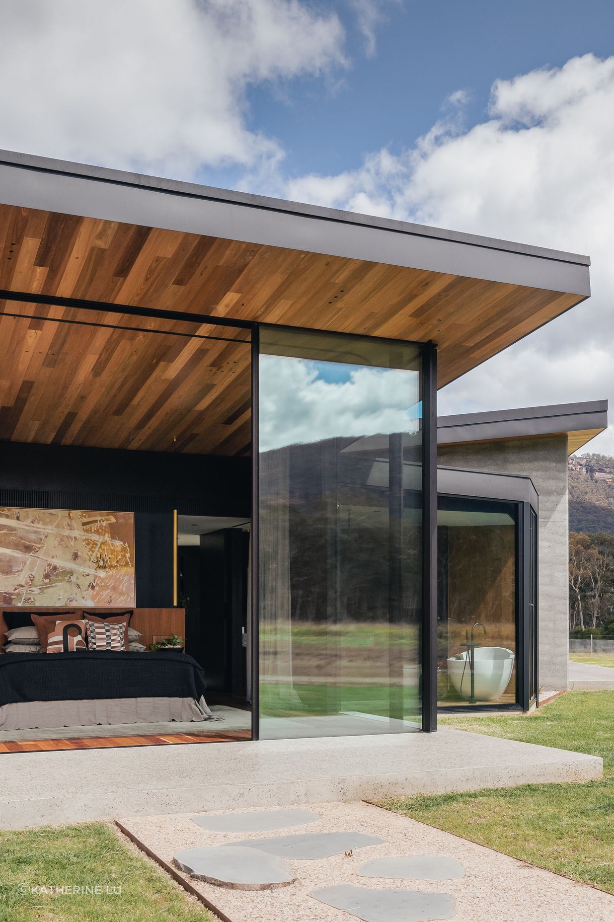 The master suite blends seamlessly into the outdoor environment.
