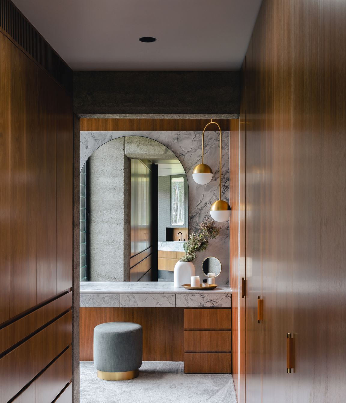 The dressing room welcomes the day with its rich and warm tones.