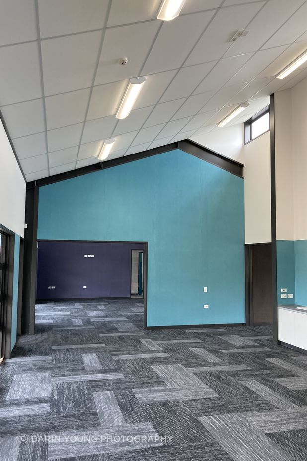 The carpet tiling imitates the weave of the panels outside.