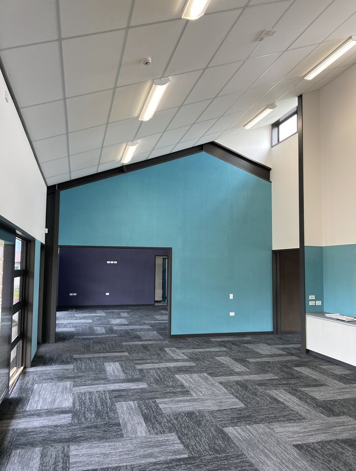 The carpet tiling imitates the weave of the panels outside.