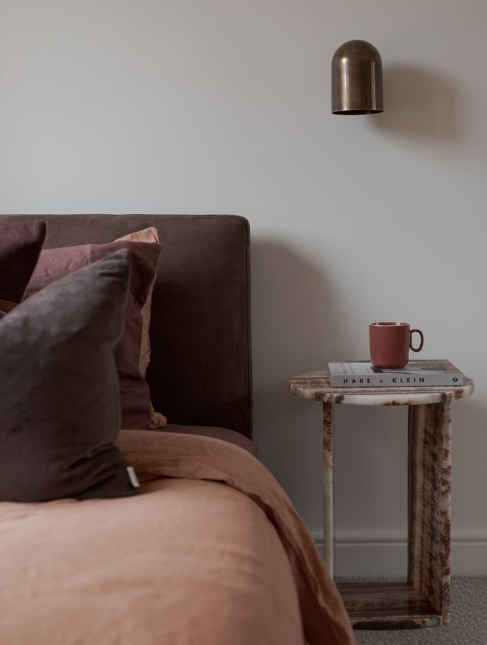 Inspired by the terracotta tiles, a material commonly used in mid-century design, the pair developed a mood board featuring bold accent colours of red, olive, and yellow alongside organic shapes and textures.