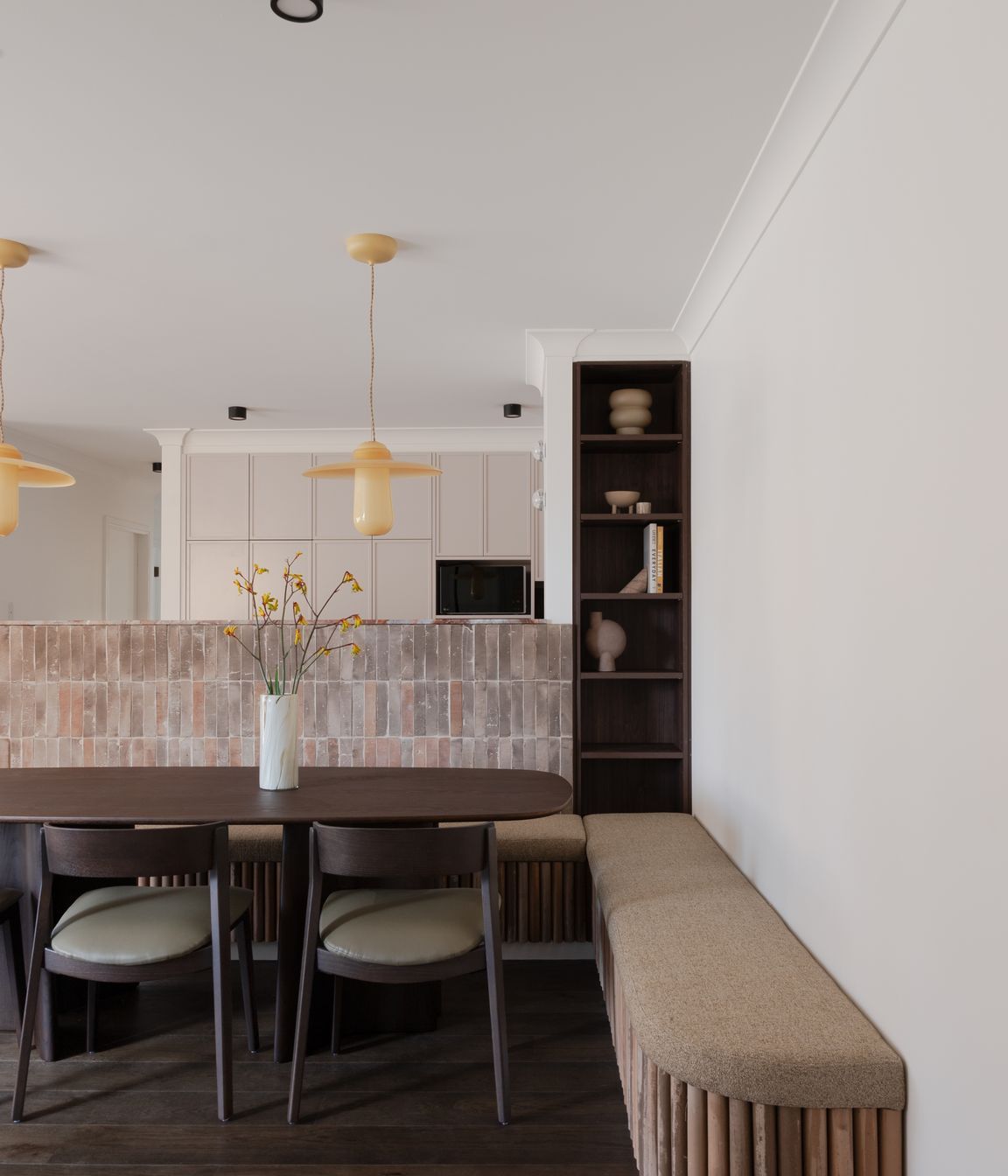 Stand-out features include honey-coloured Italian glass pendants, designed by Sjoerd Vroonand and made in the Netherlands for Space Furniture, that have been hung above the dining table.